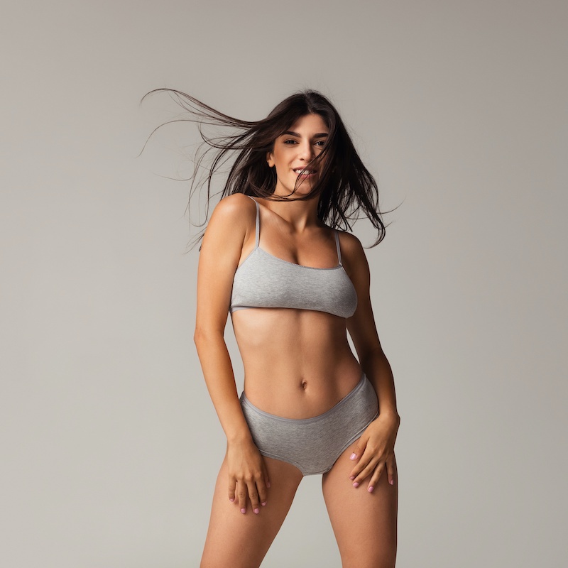 beautiful young woman in gray underwear and bra