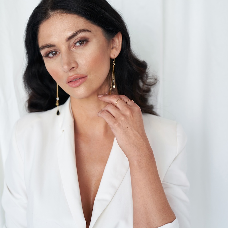 beautiful young woman wearing white shirt jacket