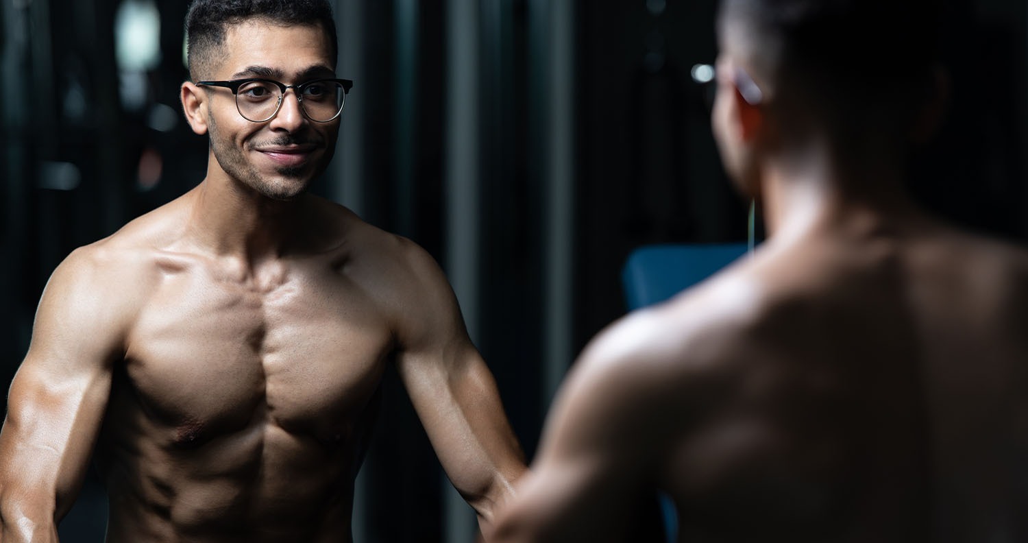 Bodybuilder With Gynecomastia Problem Flexing Muscles