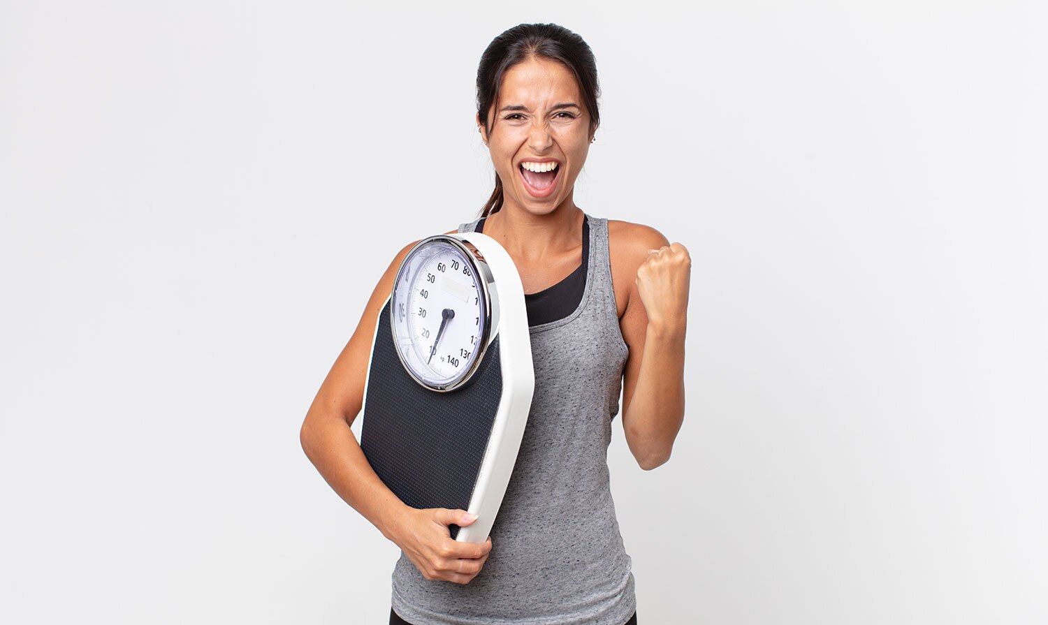 Happy woman successfully loses weight